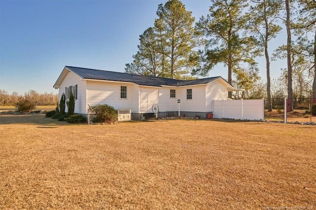 back of house with a yard