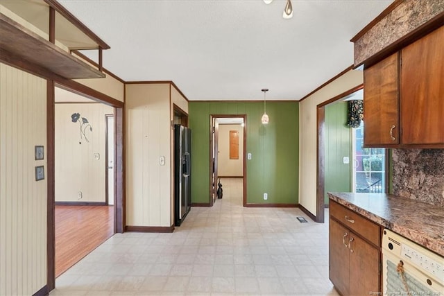 kitchen featuring stainless steel refrigerator with ice dispenser, white dishwasher, hanging light fixtures, and ornamental molding