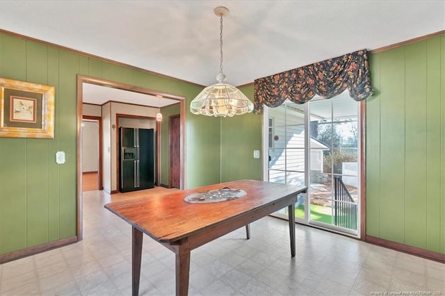 dining room featuring ornamental molding