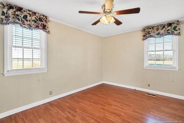 unfurnished room with wood-type flooring and ceiling fan