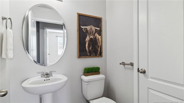 bathroom featuring sink and toilet