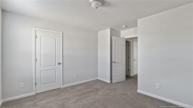 unfurnished bedroom with light carpet