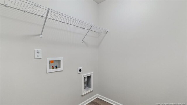 washroom with hookup for an electric dryer, wood-type flooring, and washer hookup