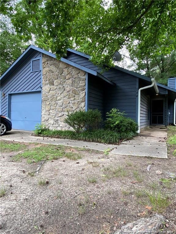 view of side of property featuring a garage