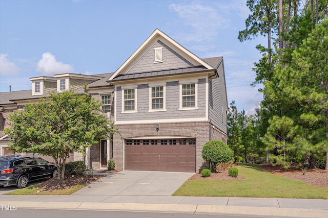 view of front of house with a garage and a front yard