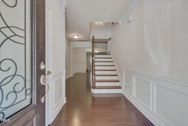 foyer entrance featuring dark hardwood / wood-style floors