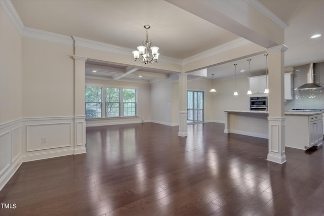 unfurnished living room with beam ceiling, coffered ceiling, dark hardwood / wood-style flooring, a notable chandelier, and ornamental molding