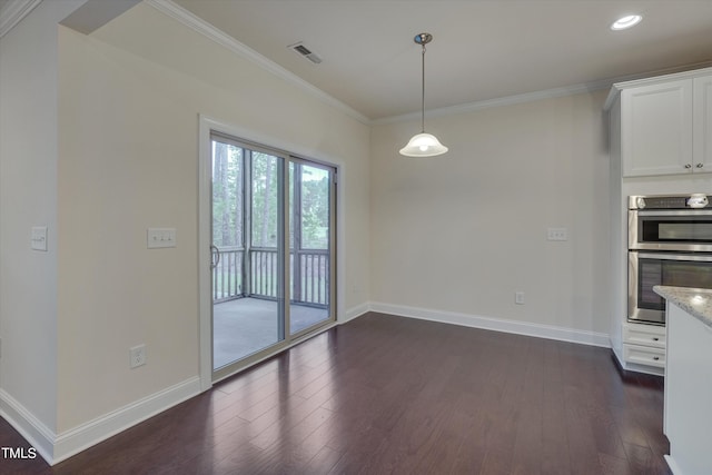 interior space with dark hardwood / wood-style floors and ornamental molding