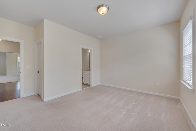 empty room with light colored carpet