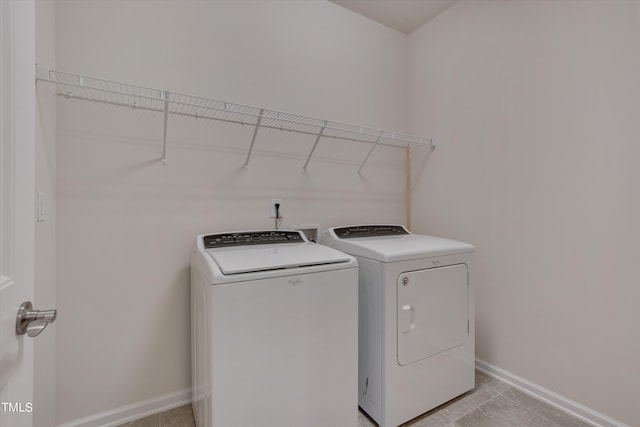 laundry room with separate washer and dryer