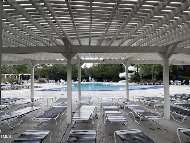 view of swimming pool with a pergola and a patio