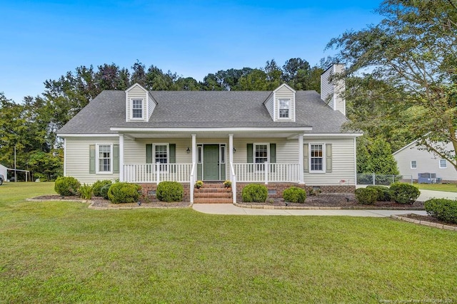 cape cod house featuring a front lawn and a porch