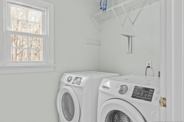 laundry area with separate washer and dryer