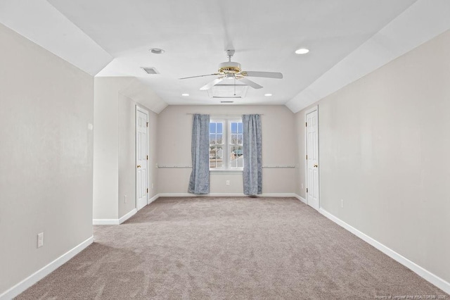 unfurnished room with light carpet, ceiling fan, and lofted ceiling