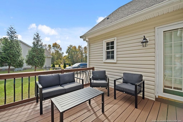 deck with a lawn and an outdoor living space