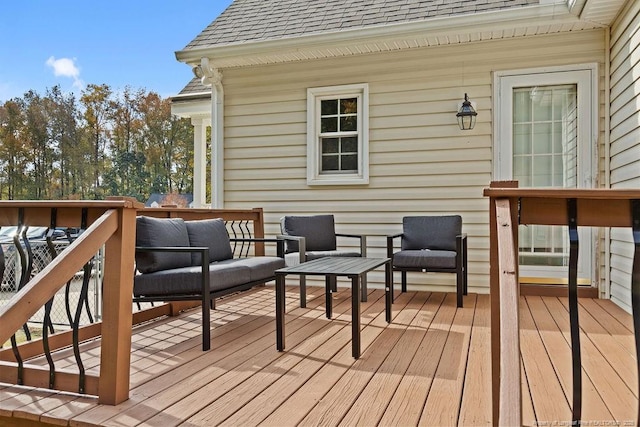 wooden deck with outdoor lounge area