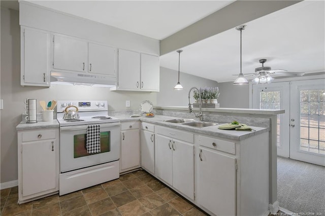 kitchen with white electric range oven, sink, hanging light fixtures, kitchen peninsula, and white cabinets