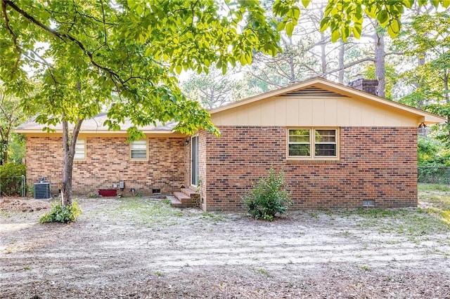 view of property exterior with central AC