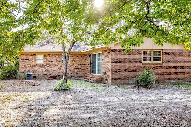 view of side of property with central AC unit