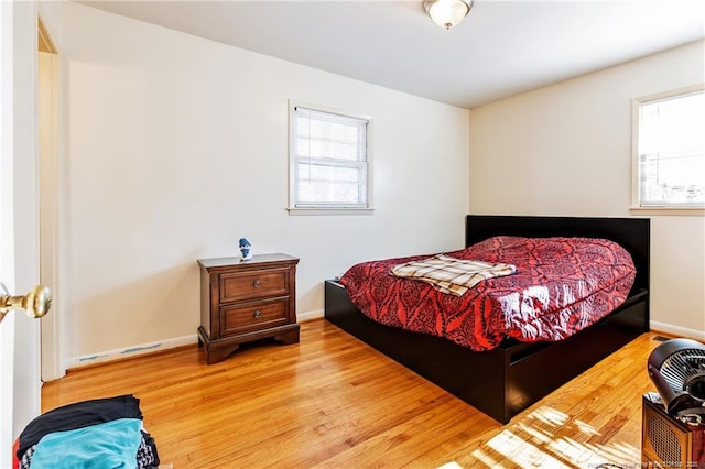 bedroom featuring wood-type flooring