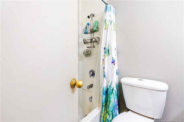 bathroom with shower / tub combo and toilet