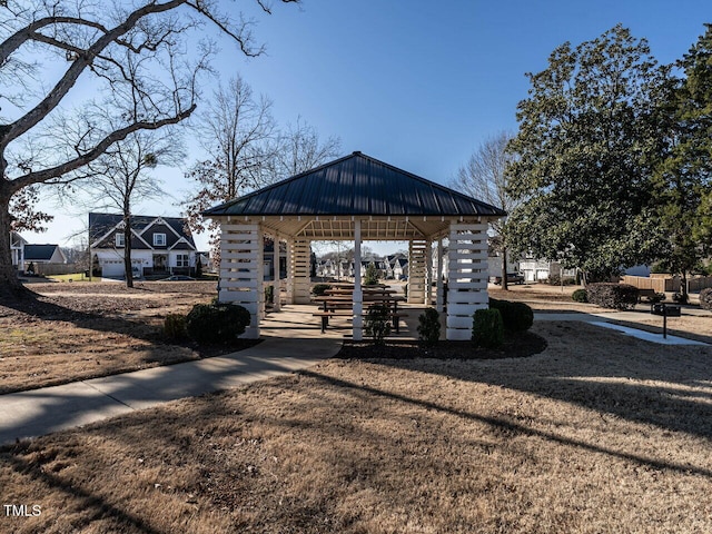 view of property's community with a gazebo and a yard