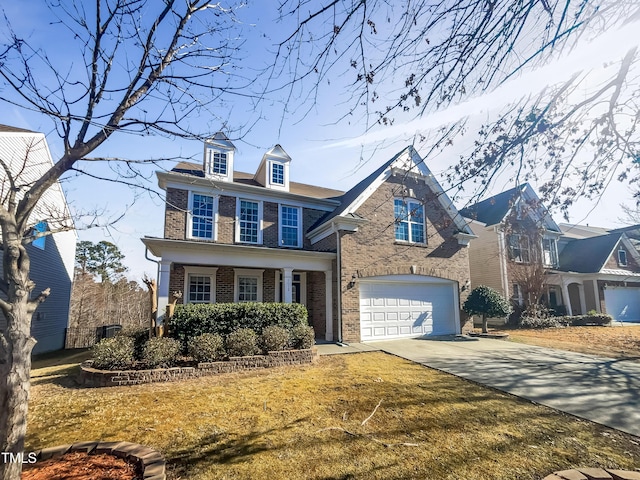 view of front of home with a garage and a front lawn