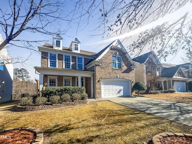 1012 Fulbright Dr, Morrisville, NC 27560 - traditional-style house featuring concrete driveway, a garage, and brick siding