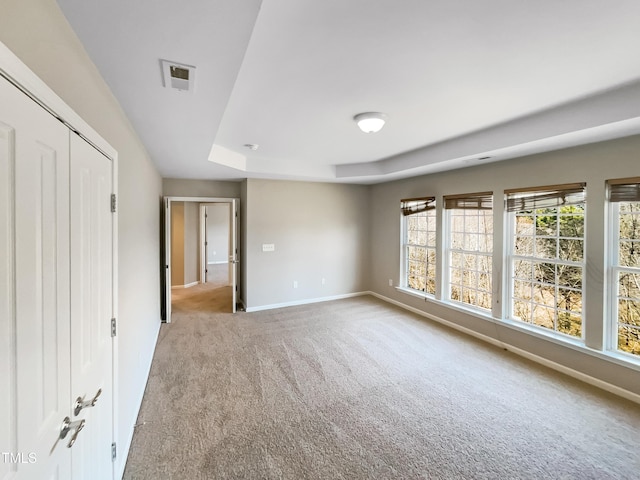 1012 Fulbright Dr, Morrisville, NC 27560 - unfurnished bedroom featuring carpet flooring and a raised ceiling