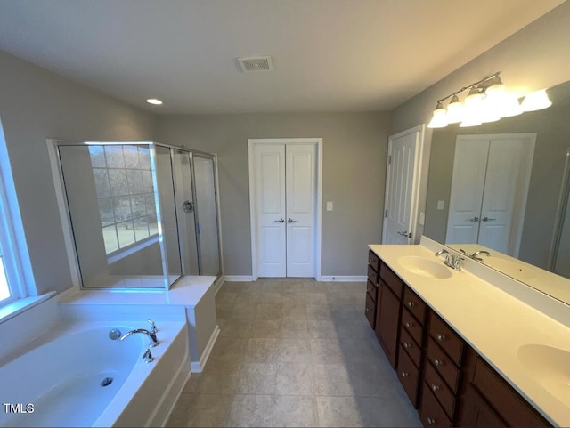 1012 Fulbright Dr, Morrisville, NC 27560 - bathroom featuring double vanity, a garden tub, an enclosed shower, and recessed lighting