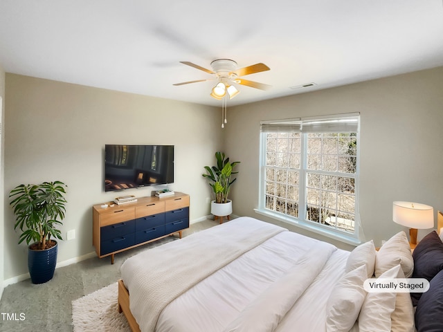 1012 Fulbright Dr, Morrisville, NC 27560 - carpeted bedroom featuring baseboards and a ceiling fan