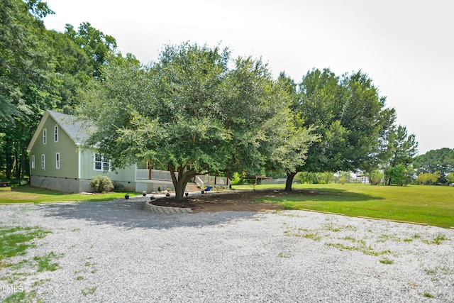 view of front of home featuring a front yard and crawl space