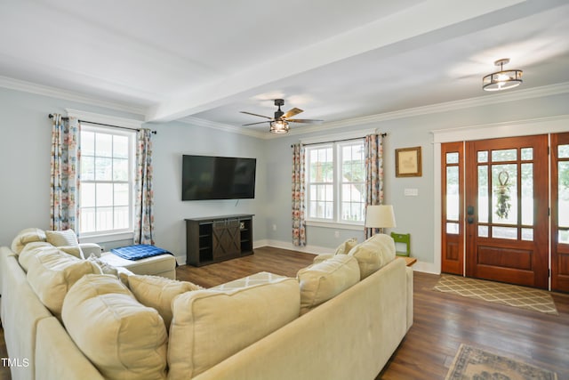 living room featuring ornamental molding, dark wood-style flooring, and baseboards