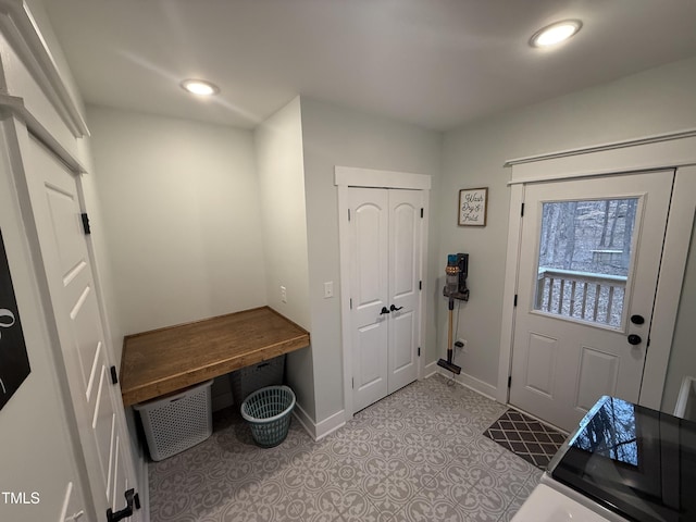 mudroom featuring recessed lighting and baseboards