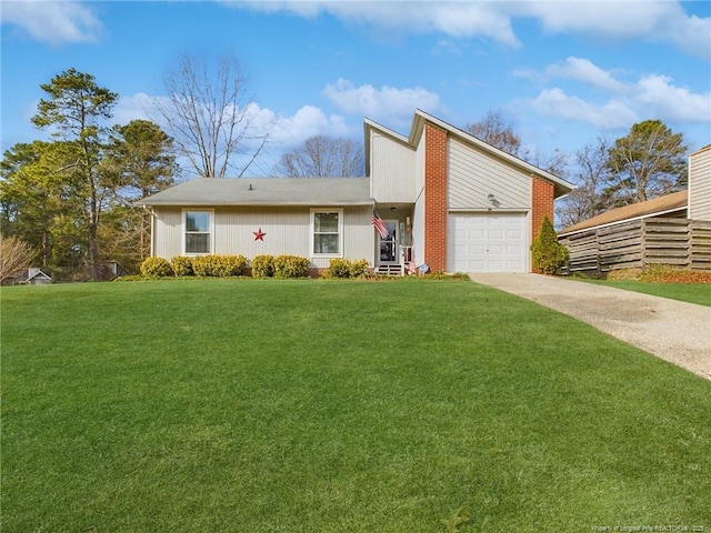 view of front facade featuring a garage and a front lawn