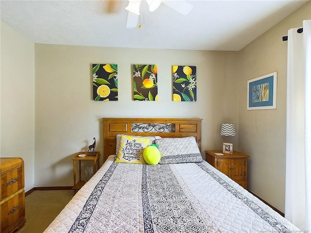 bedroom featuring dark colored carpet and ceiling fan