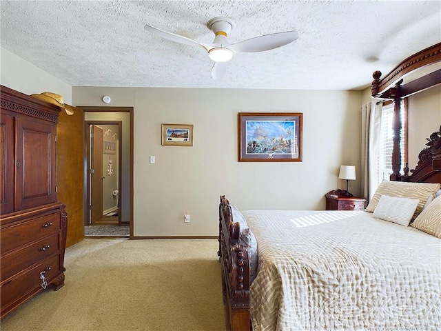 carpeted bedroom with a textured ceiling and ceiling fan