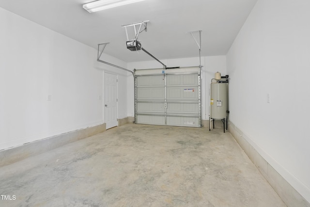 garage with electric water heater and a garage door opener