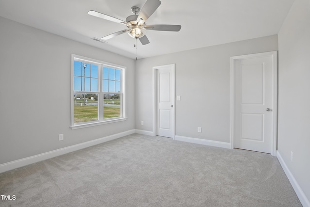 unfurnished bedroom with carpet flooring, baseboards, and visible vents