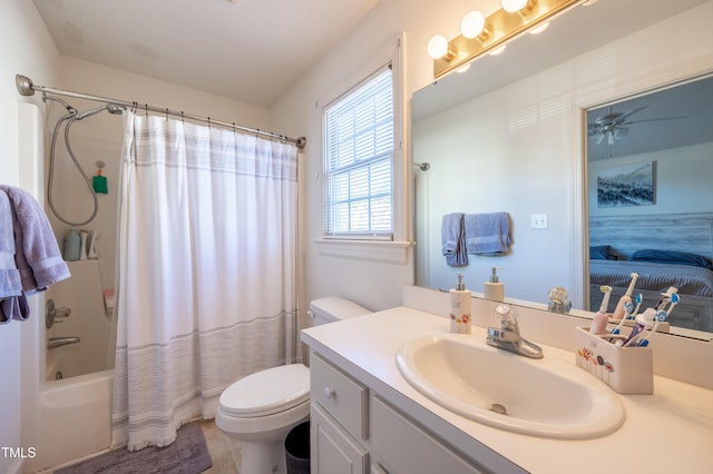 full bathroom with shower / bath combination with curtain, ceiling fan, toilet, and vanity