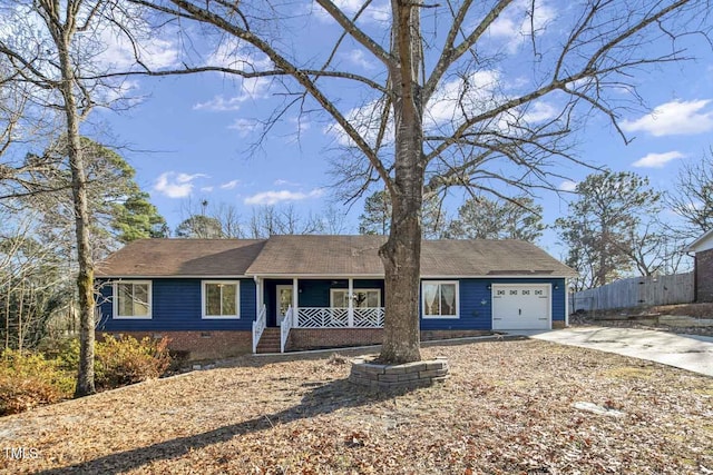 single story home featuring a porch and a garage