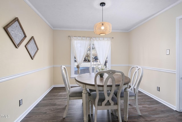 dining space featuring dark hardwood / wood-style flooring and crown molding