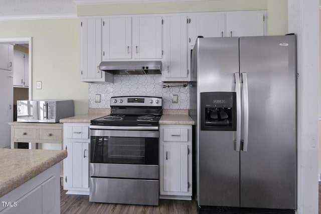 kitchen featuring appliances with stainless steel finishes, backsplash, ornamental molding, dark wood-type flooring, and white cabinets