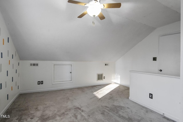 bonus room with ceiling fan, light colored carpet, and vaulted ceiling