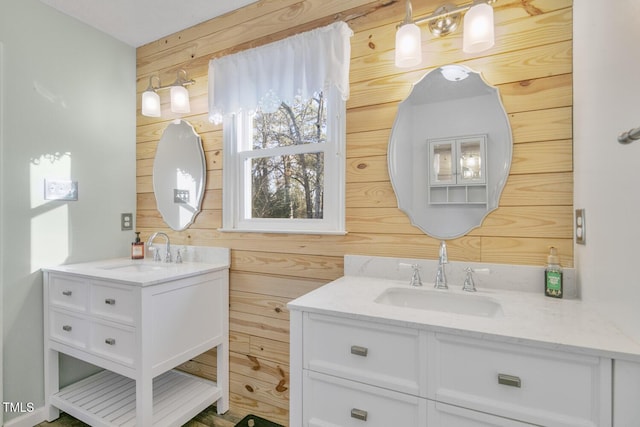 bathroom with vanity and wood walls