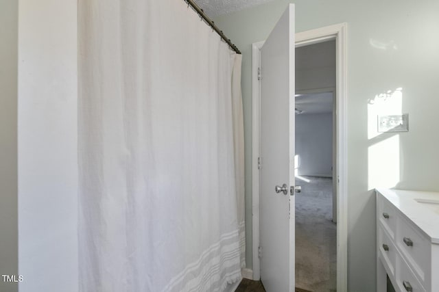 bathroom featuring vanity and a textured ceiling