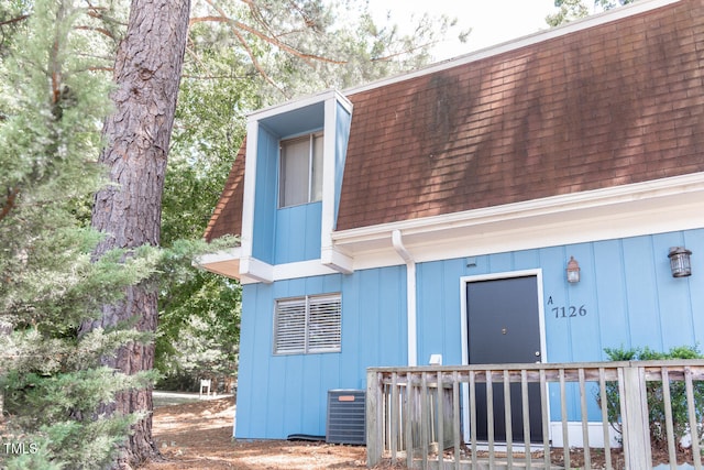 rear view of house with central AC