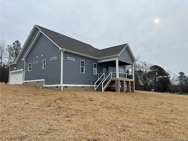 rear view of property featuring covered porch