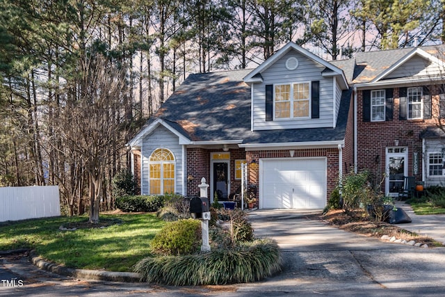 view of front facade featuring a garage and a front lawn