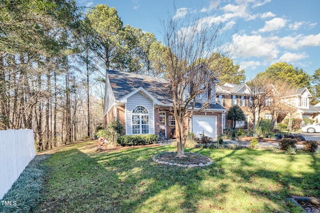 view of front facade with a garage and a front yard